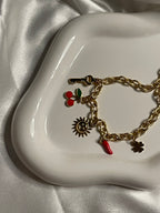 Collier doré maille avec pendentif soleil et cerise