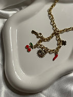 Collier doré maille avec pendentif soleil et cerise