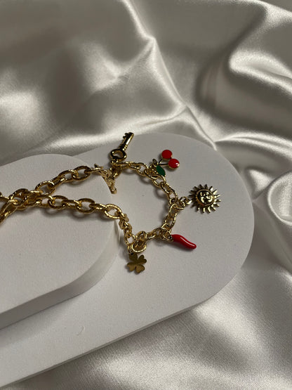 Collier doré maille avec pendentif soleil et cerise