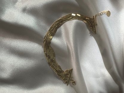 
Bracelet doré avec multi chaînes reliées
